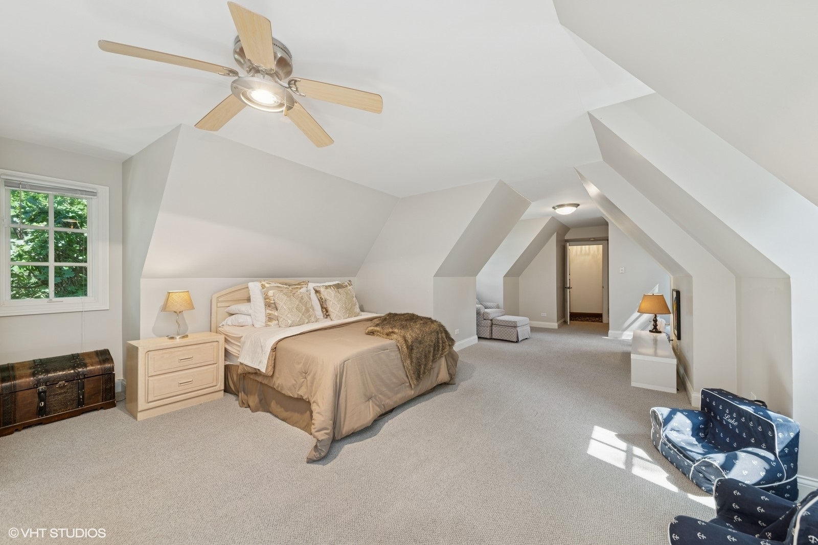 580 Oak Street Glen Ellyn, IL 60137 - Photo 55 of 93 a spacious bedroom with a bed and a chandelier