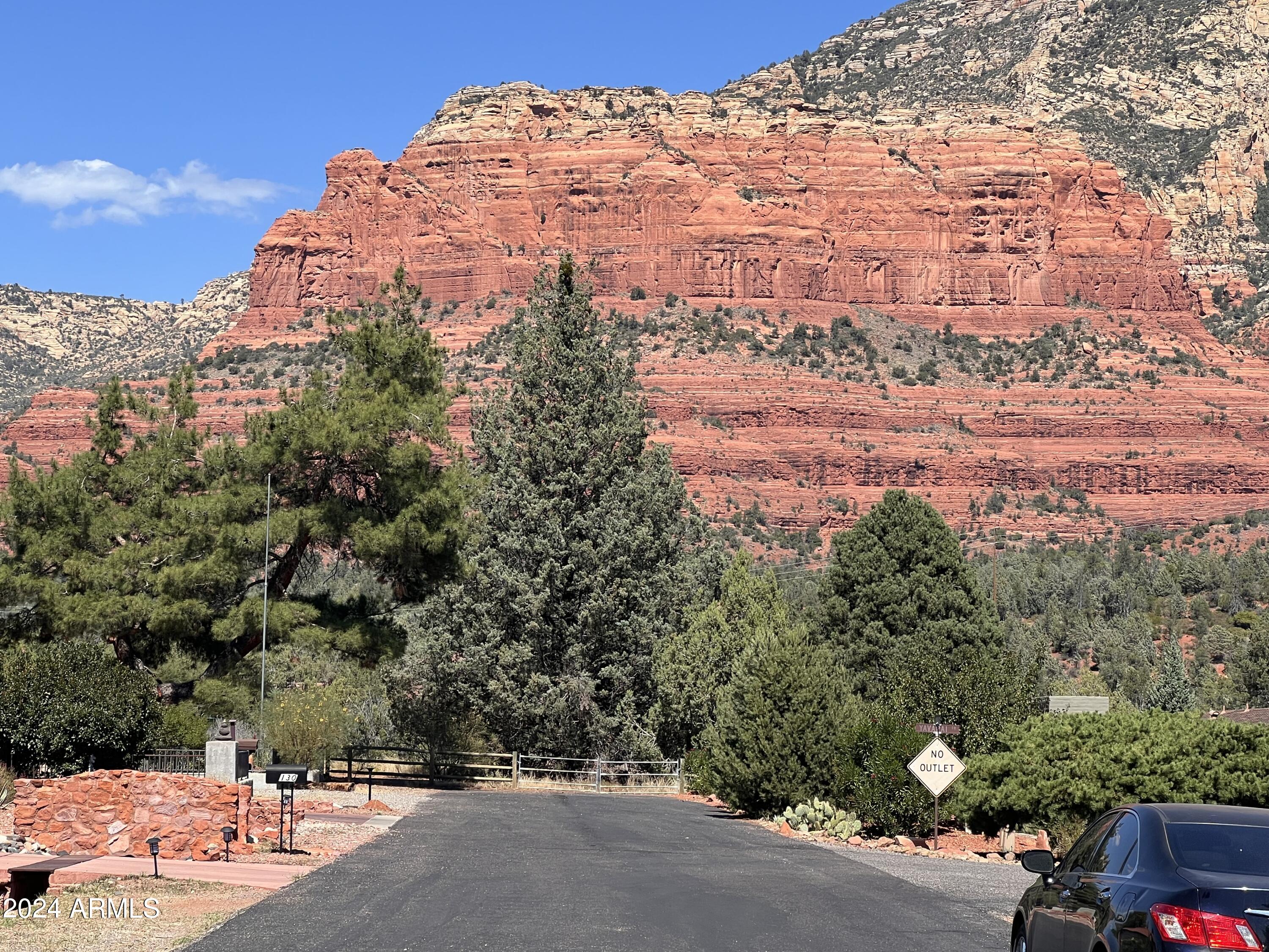 90 Tonto Road Sedona, AZ 86336 - Photo 1 of 21 Standing in front of house