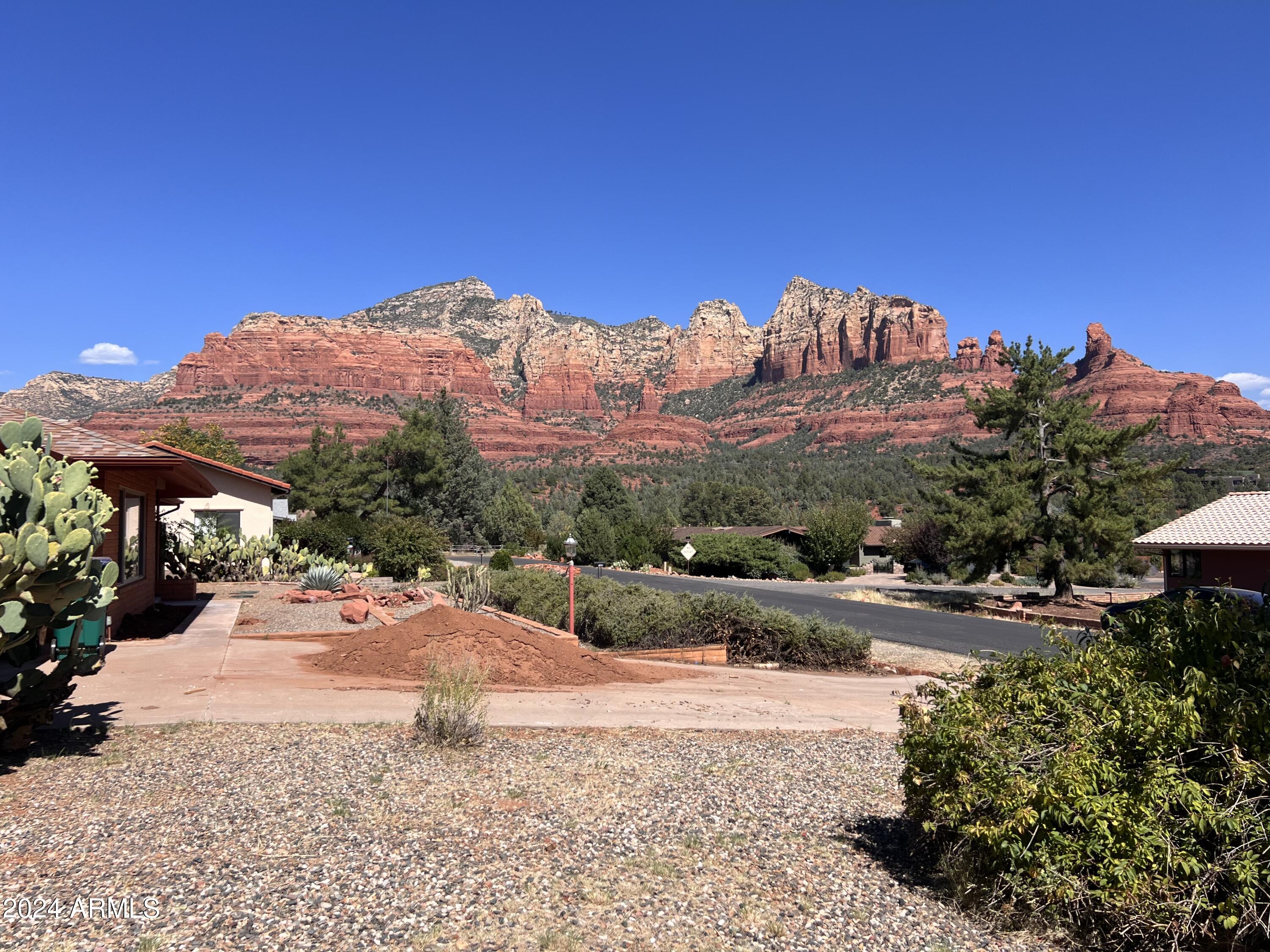 90 Tonto Road Sedona, AZ 86336 - Photo 4 of 21 Standing on side of home