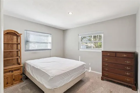 a bedroom with a bed and closet