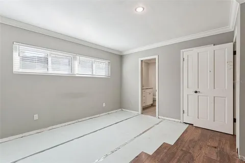 a room with a bed and a window