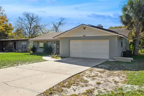 a view of garage yard and tree