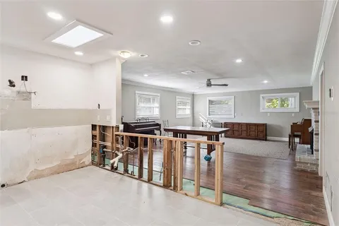 a kitchen with stainless steel appliances granite countertop a refrigerator a stove and a sink