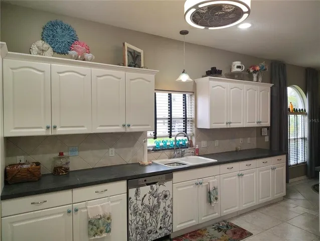 a living room with furniture floor to ceiling window and a floor to ceiling window