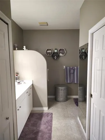 a bedroom with a bed and a closet