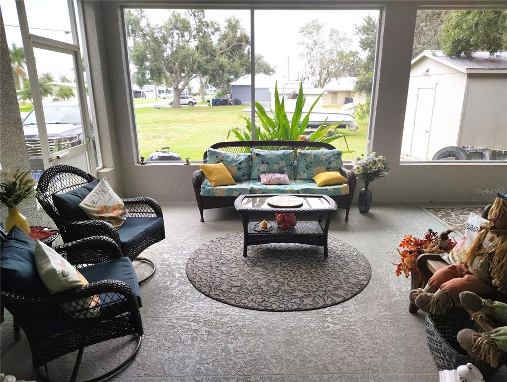 3315 Elm Street Ellenton, FL 34222 - Photo 20 of 51 a living room with furniture floor to ceiling window and a floor to ceiling window