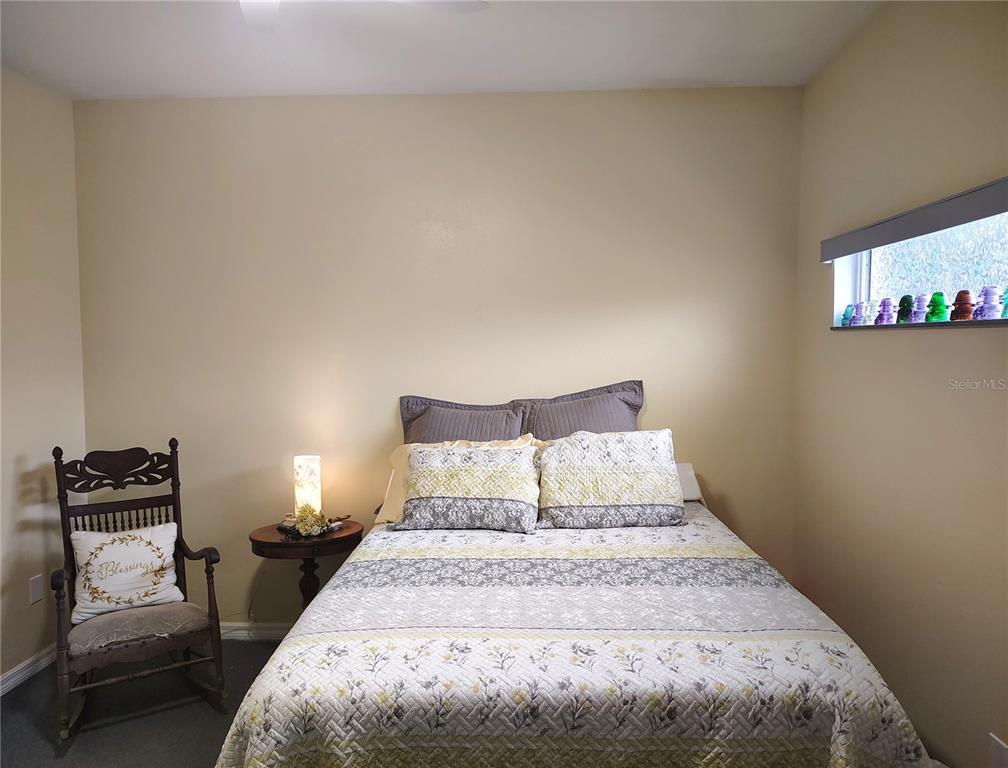 3315 Elm Street Ellenton, FL 34222 - Photo 27 of 51 a bedroom with a bed and wooden floor
