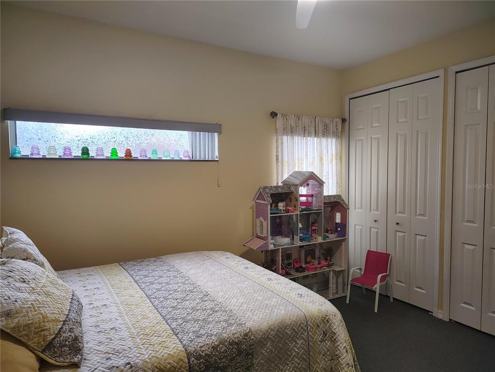 3315 Elm Street Ellenton, FL 34222 - Photo 28 of 51 a bedroom with a bed and a closet