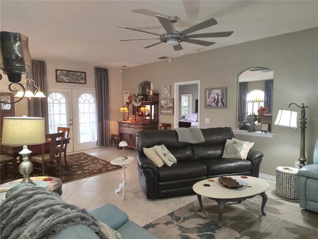 a kitchen with granite countertop white cabinets and sink