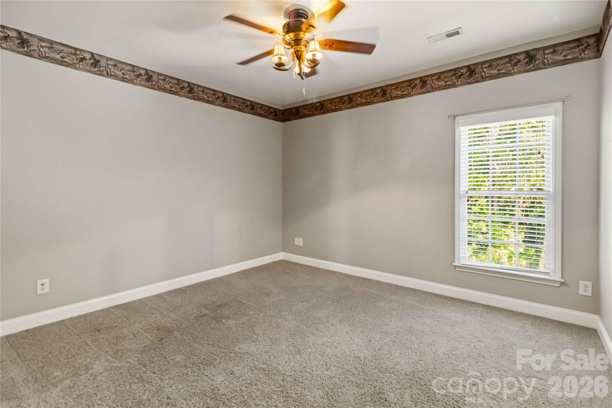 2436 Commons Court Fort Mill, SC 29708 - Photo 30 of 43 a view of an empty room with a window