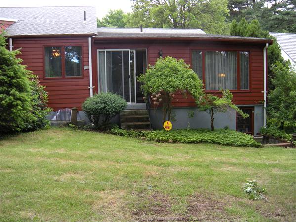 117 Radcliffe Road Belmont, MA 02478 - Photo 6 of 6 a front view of a house with garden