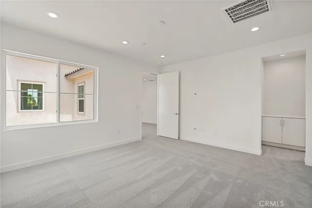 en empty room with windows