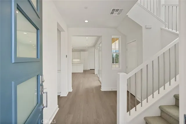 a view of entryway with wooden floor
