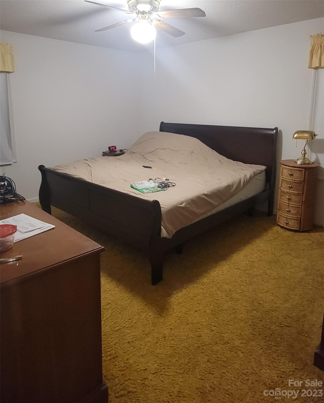 1366 Ridge Avenue Mount Pleasant, NC 28124 - Photo 16 of 28 a bedroom with a bed and a table in it