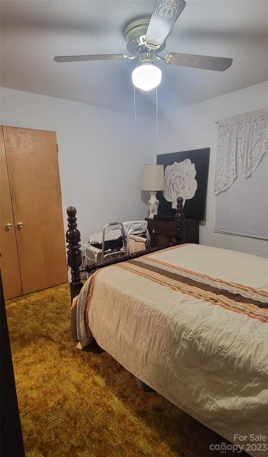 1366 Ridge Avenue Mount Pleasant, NC 28124 - Photo 20 of 28 a bed sitting in a bedroom next to a window and a chandelier