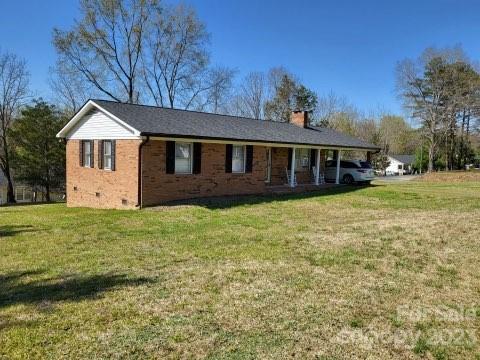 1366 Ridge Avenue Mount Pleasant, NC 28124 - Photo 2 of 28 a view of a house with a yard