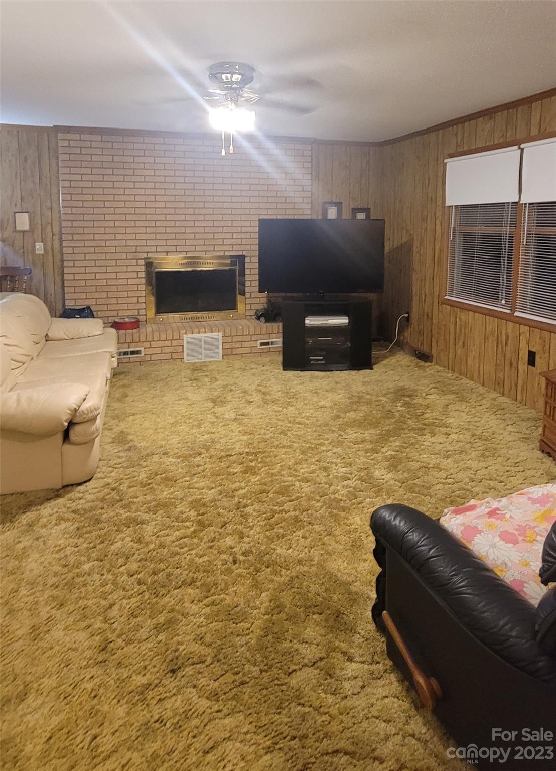 1366 Ridge Avenue Mount Pleasant, NC 28124 - Photo 6 of 28 a living room with furniture and a flat screen tv