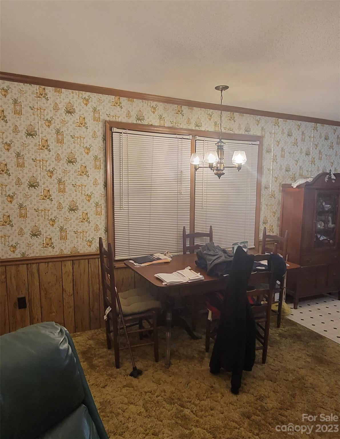 1366 Ridge Avenue Mount Pleasant, NC 28124 - Photo 8 of 28 a room with a table chairs and a refrigerator