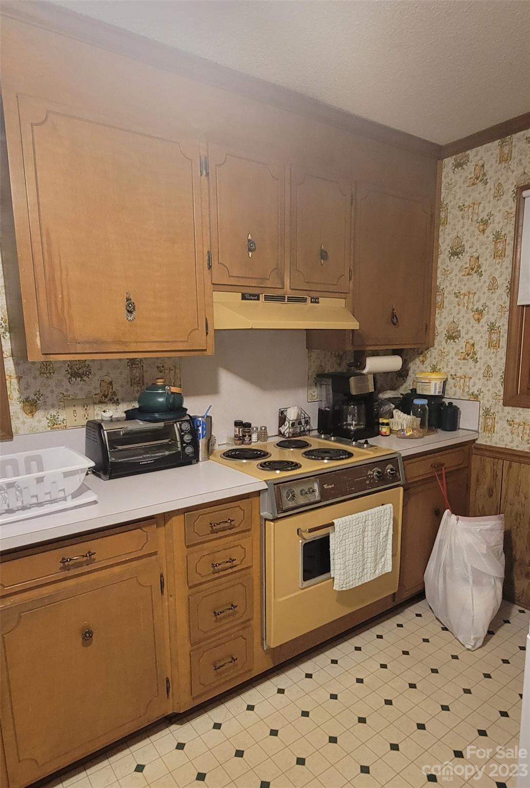 1366 Ridge Avenue Mount Pleasant, NC 28124 - Photo 10 of 28 a kitchen with granite countertop a sink a stove and cabinets