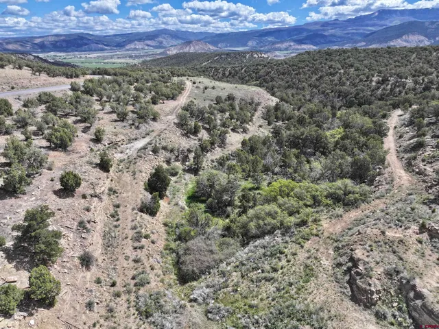 a view of a city with mountains in the background
