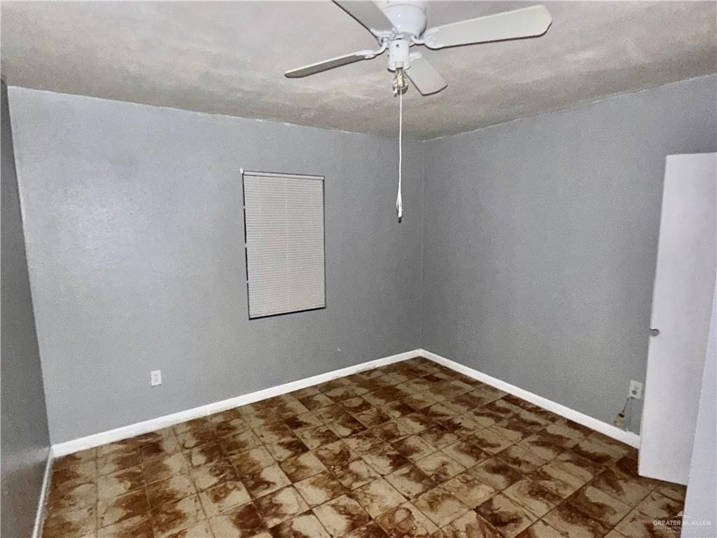 204 Ramon Private Road Mission, TX 78572 - Photo 6 of 11 Room featuring a ceiling fan, window with blinds, and tiled flooring