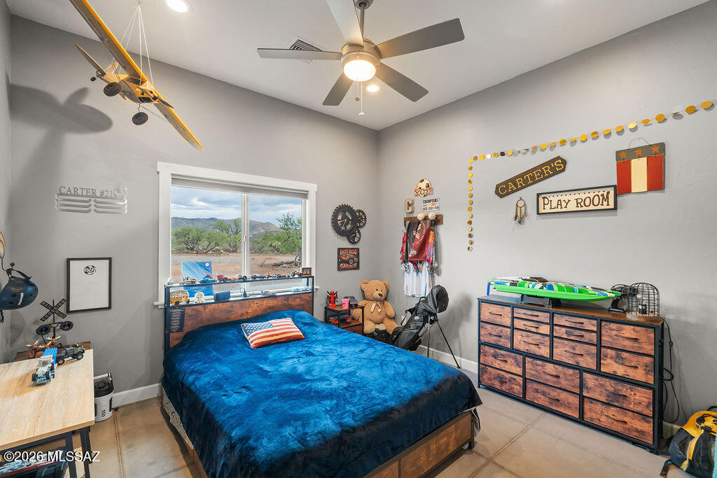 16276 East Empire View Road Vail, AZ 85641 - Photo 23 of 51 a bed room with furniture and a window