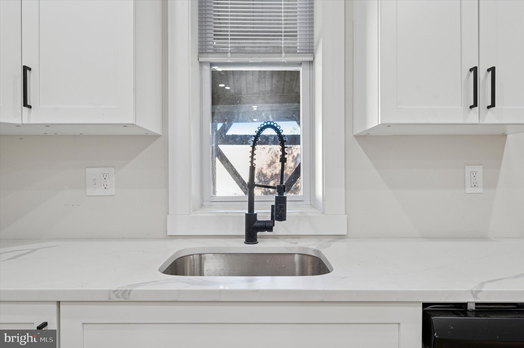 255 South 44th Street, Unit 1 Philadelphia, PA 19104 - Photo 12 of 26 a close view of a sink and a cabinet in the kitchen