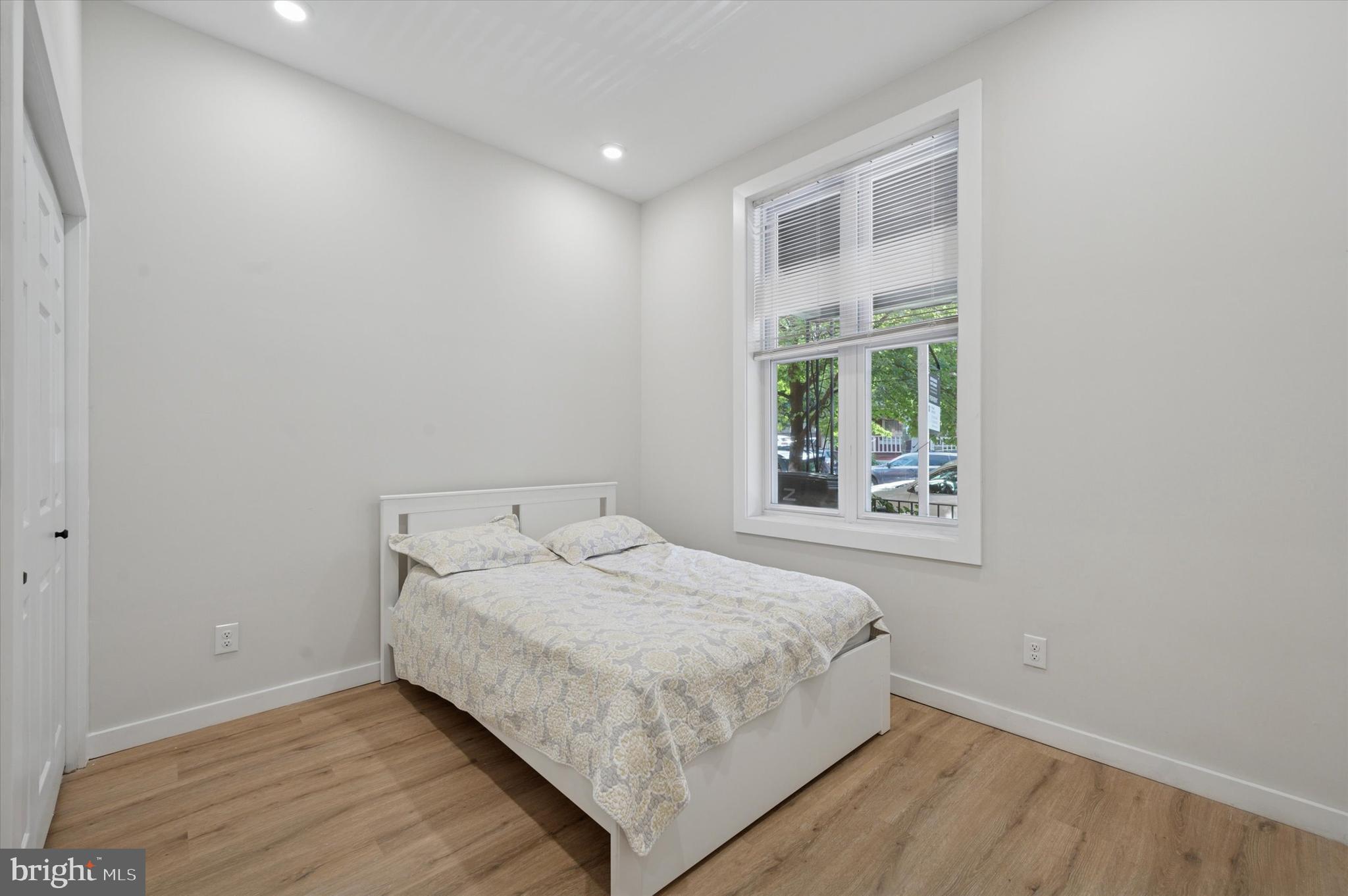 255 South 44th Street, Unit 1 Philadelphia, PA 19104 - Photo 15 of 26 a bedroom with a bed and a window