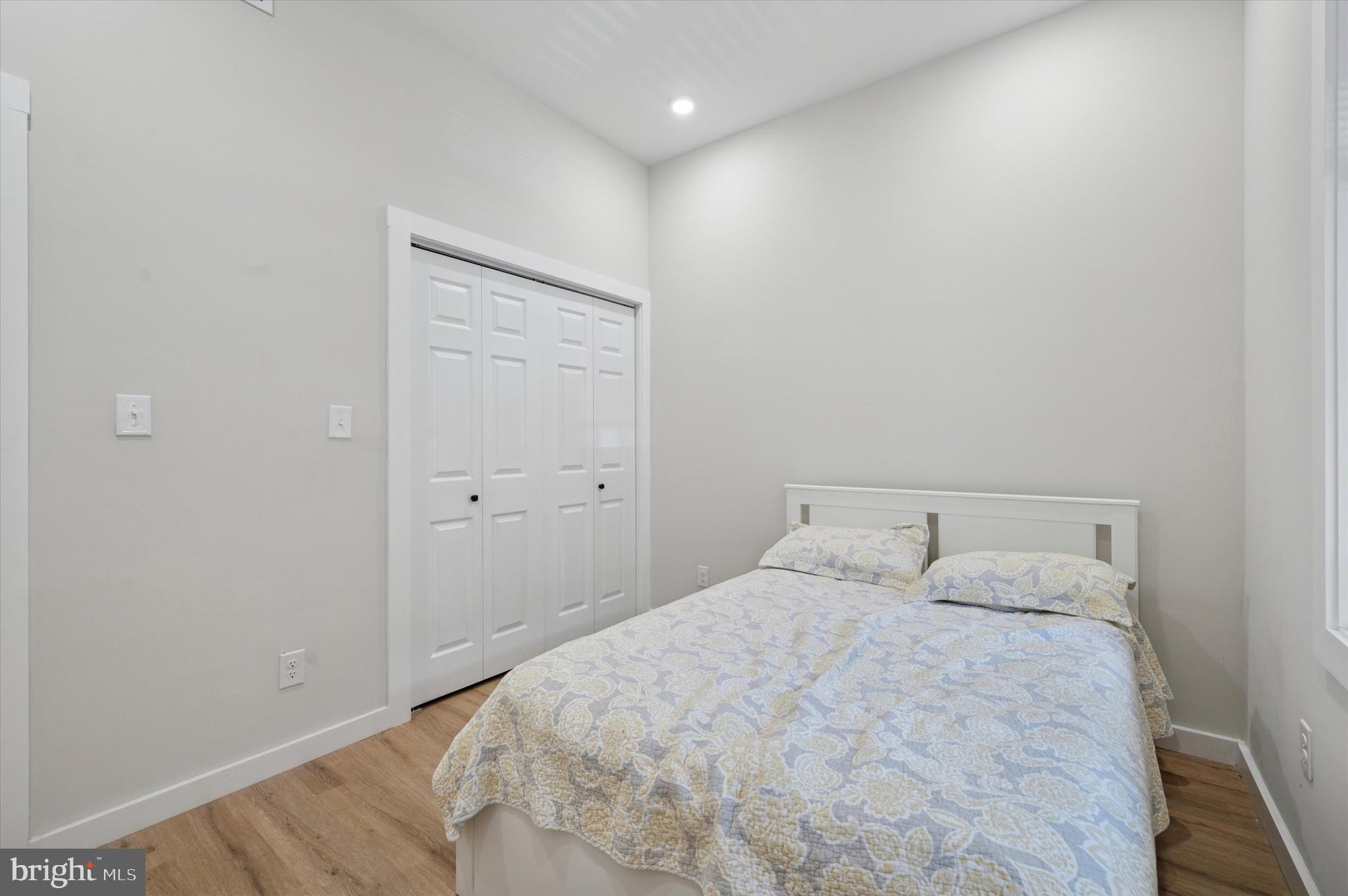 255 South 44th Street, Unit 1 Philadelphia, PA 19104 - Photo 16 of 26 a bedroom with a bed and a mirror