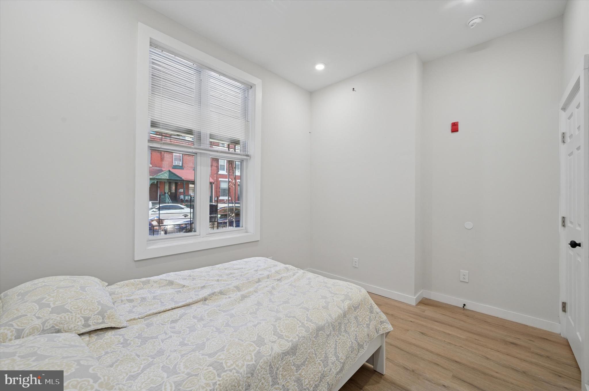 255 South 44th Street, Unit 1 Philadelphia, PA 19104 - Photo 17 of 26 a bedroom with a bed and a window