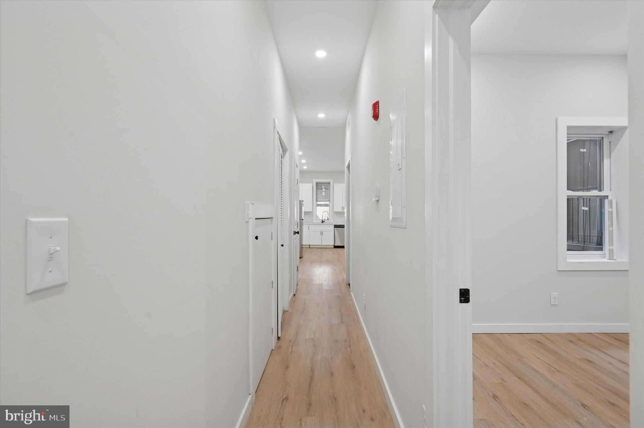 255 South 44th Street, Unit 1 Philadelphia, PA 19104 - Photo 18 of 26 a view of a hallway with wooden floor and a bathroom