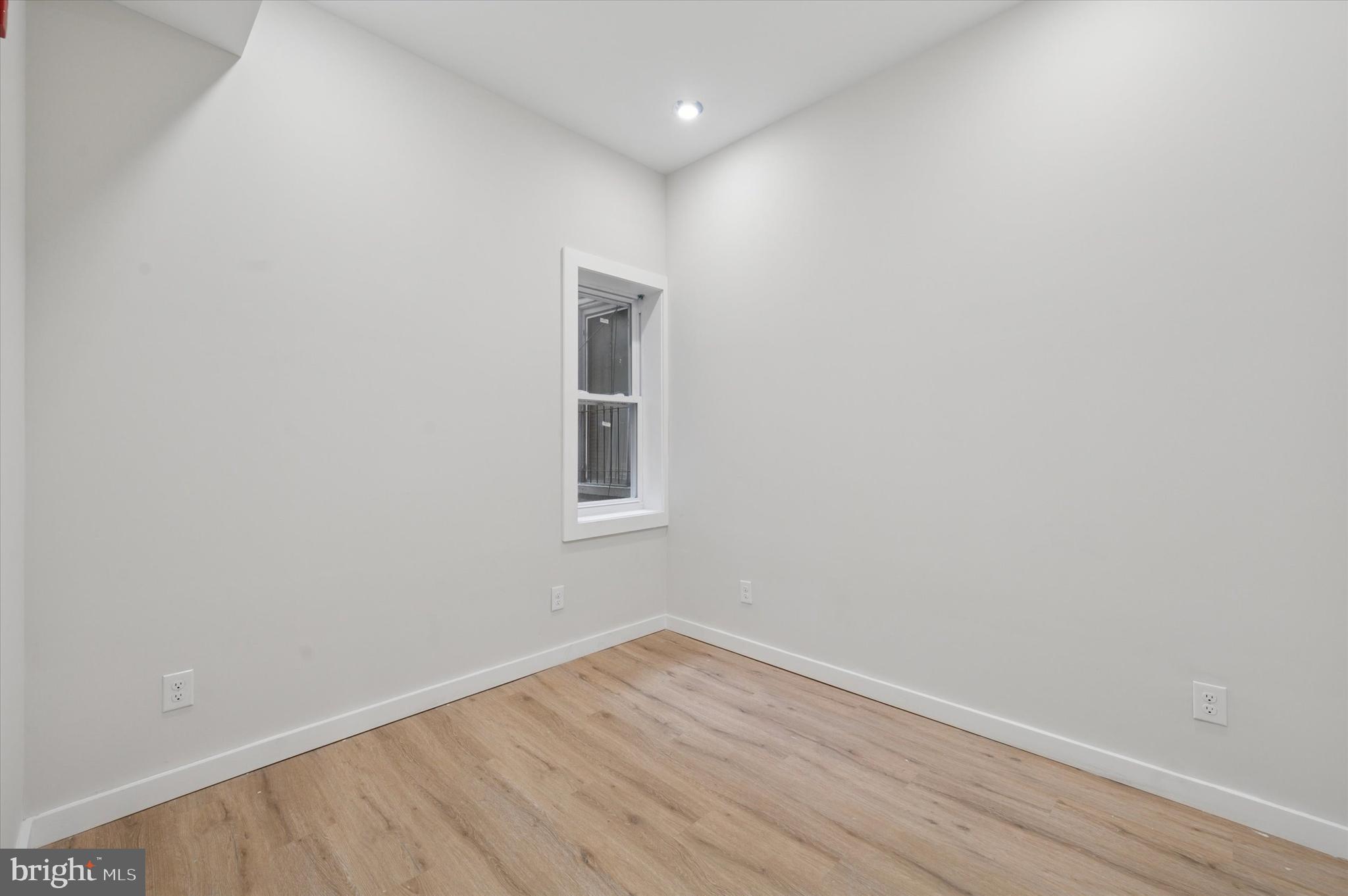 255 South 44th Street, Unit 1 Philadelphia, PA 19104 - Photo 19 of 26 a view of a room with wooden floor and windows