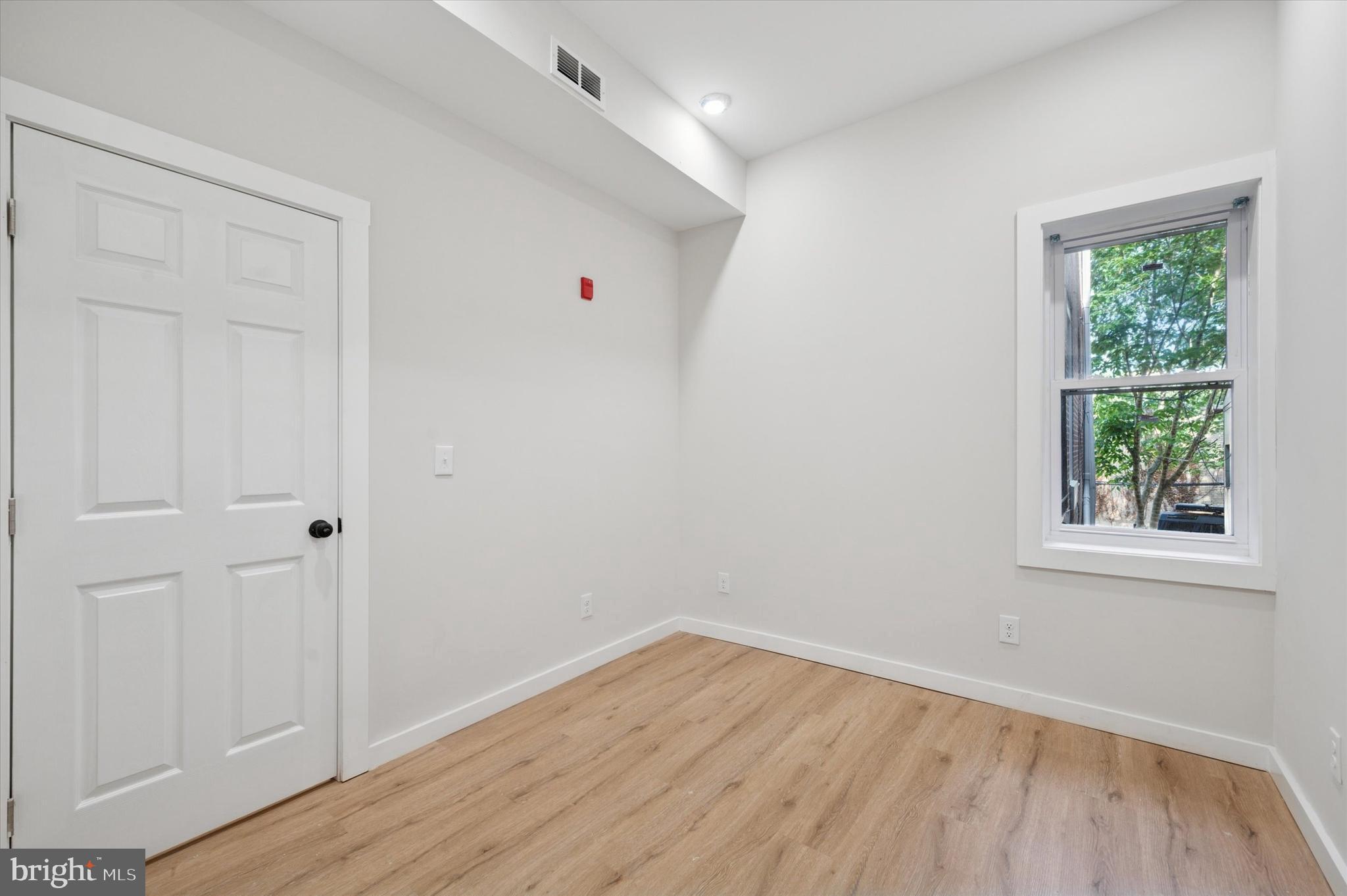255 South 44th Street, Unit 1 Philadelphia, PA 19104 - Photo 20 of 26 a view of empty room with wooden floor and fan