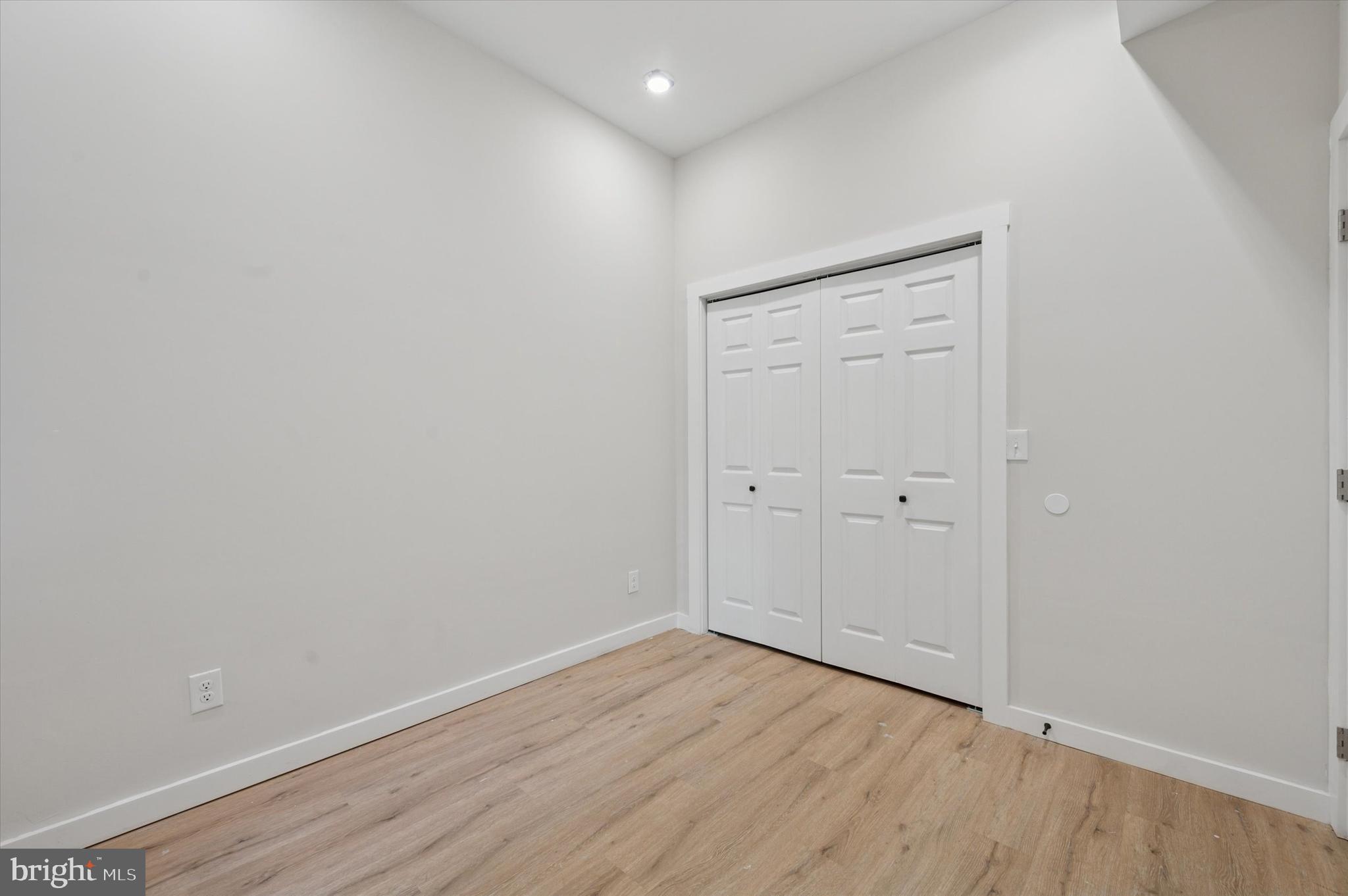 255 South 44th Street, Unit 1 Philadelphia, PA 19104 - Photo 22 of 26 wooden floor in an empty room