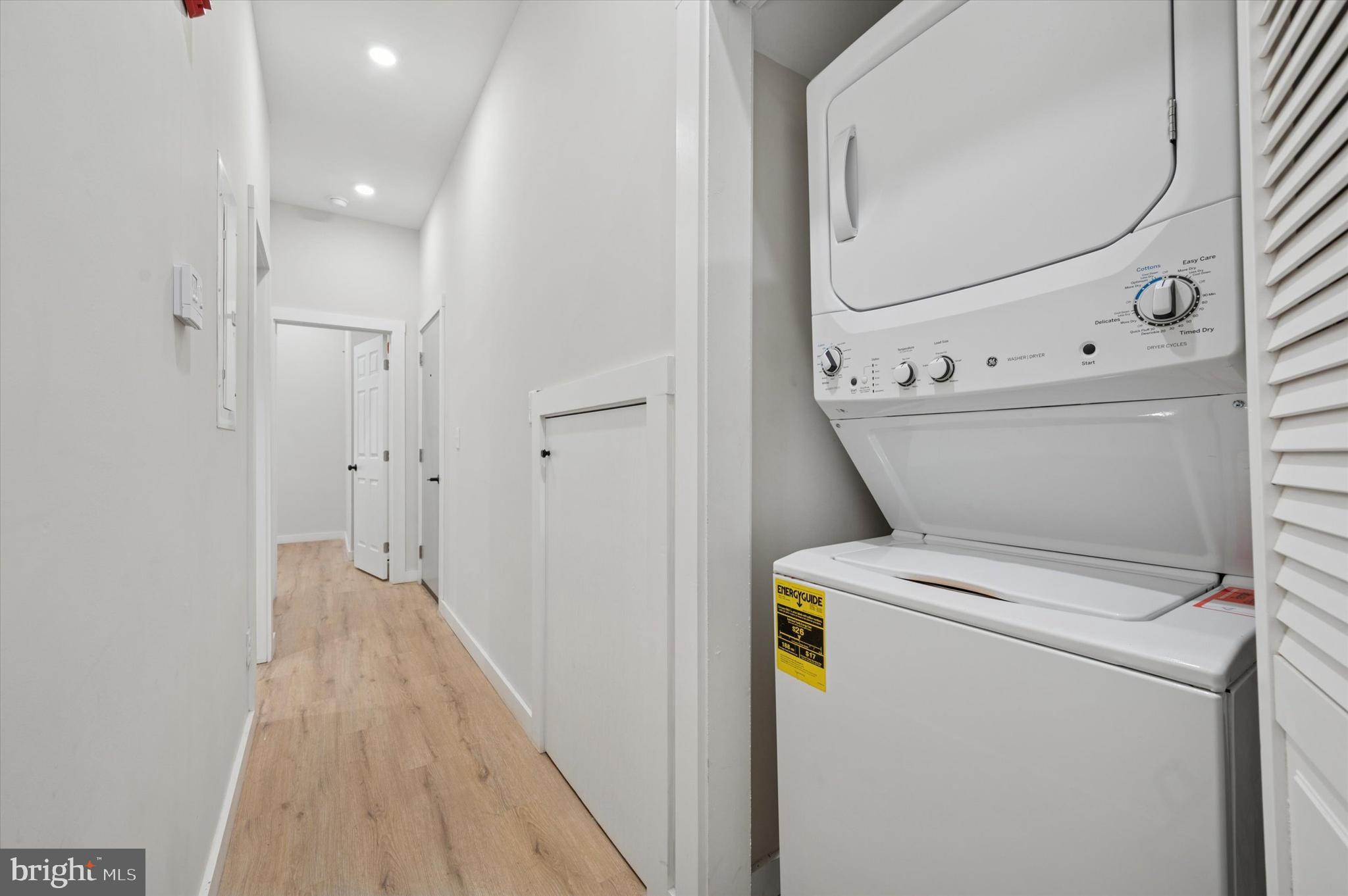 255 South 44th Street, Unit 1 Philadelphia, PA 19104 - Photo 23 of 26 a view of washer and dryer with wooden floor