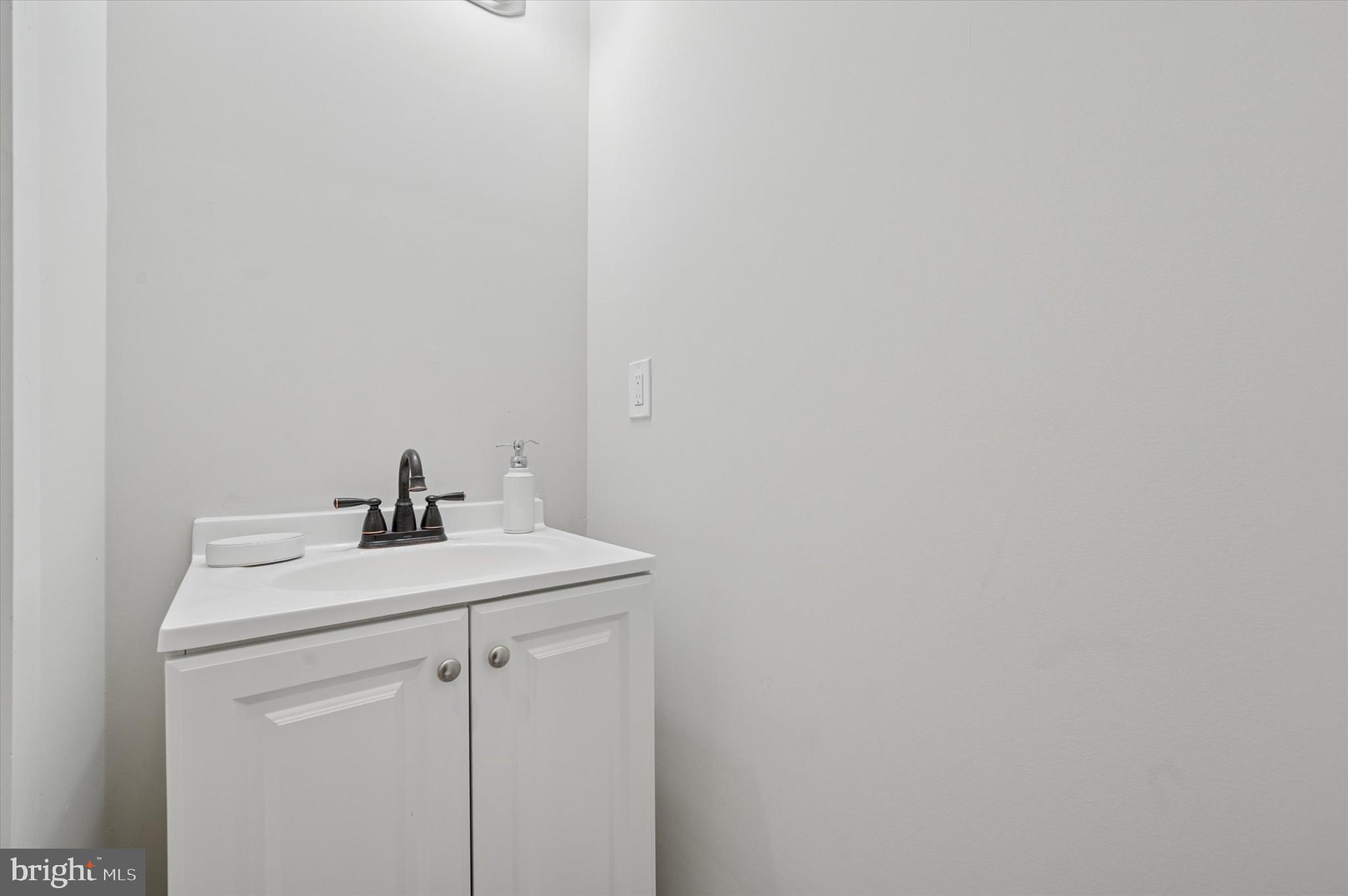 255 South 44th Street, Unit 1 Philadelphia, PA 19104 - Photo 26 of 26 a bathroom with a sink and vanity