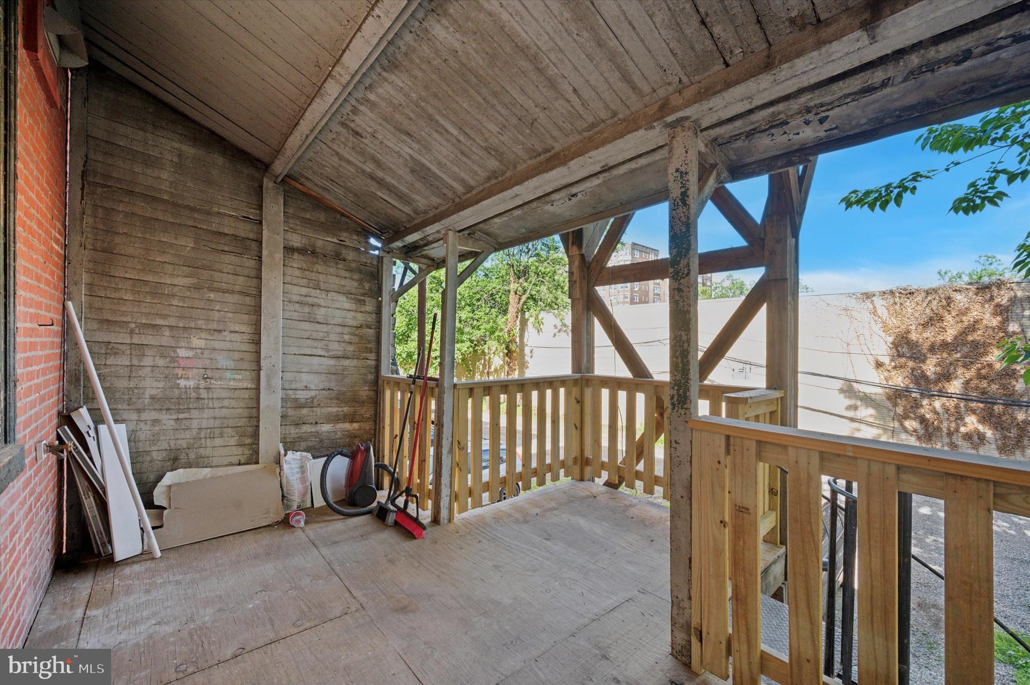 255 South 44th Street, Unit 1 Philadelphia, PA 19104 - Photo 3 of 26 a view of a porch with furniture and floor to ceiling window