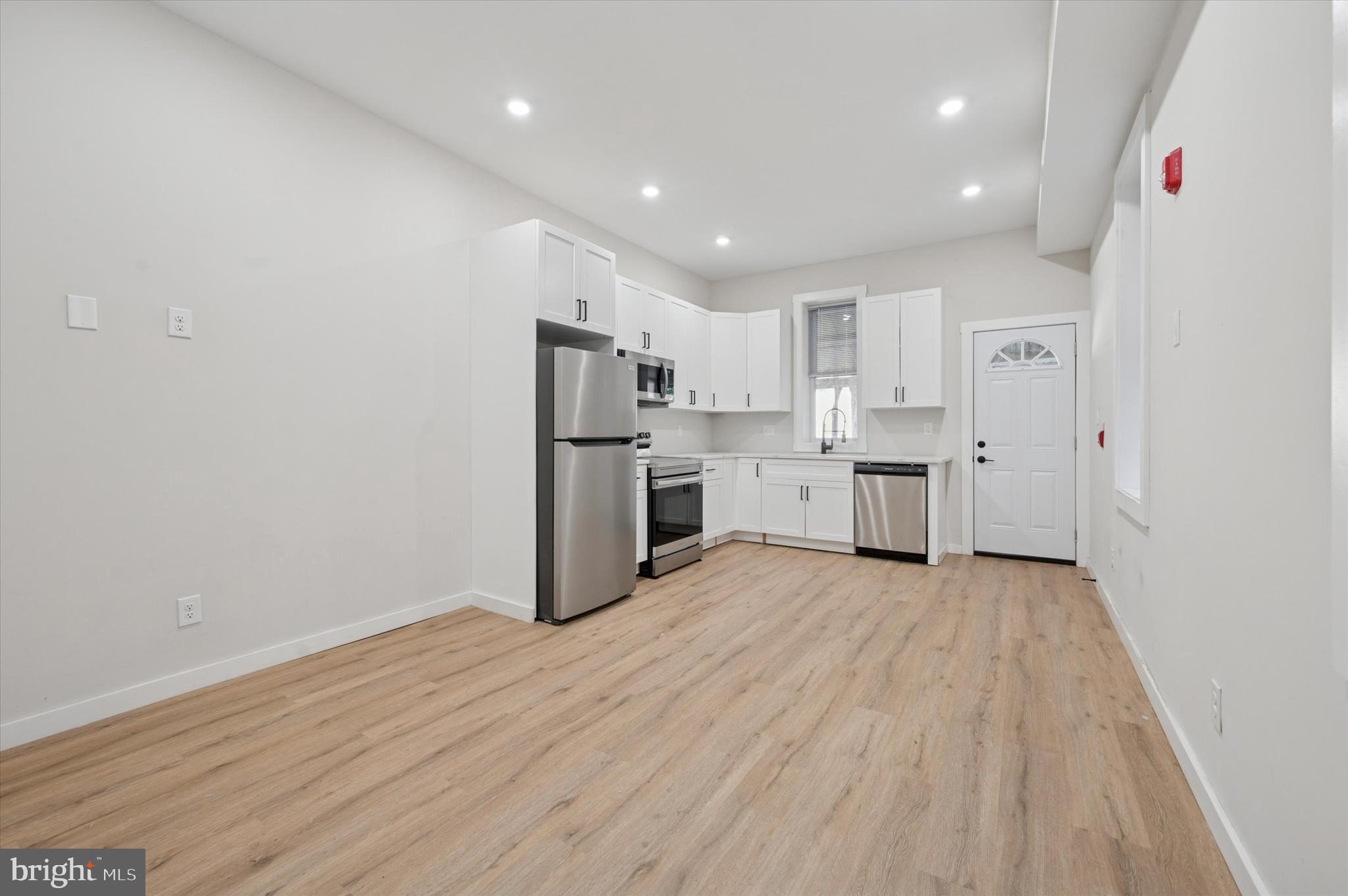 255 South 44th Street, Unit 1 Philadelphia, PA 19104 - Photo 6 of 26 a view of kitchen with wooden floor