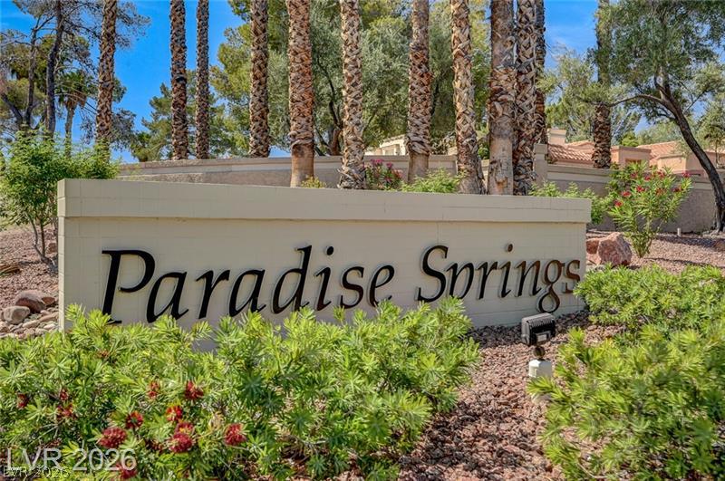 5370 Runningbrook Road Las Vegas, NV 89120 - Photo 27 of 30 A welcoming stone monument surrounded by vibrant foliage marks the entry to Paradise Springs.