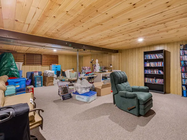 a living room with furniture a table and chairs