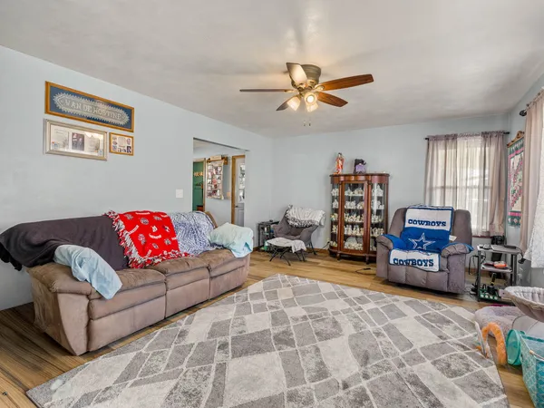 a living room with furniture and a flat screen tv
