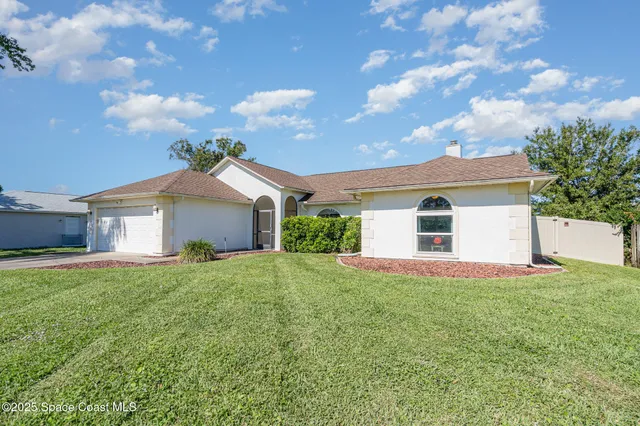 a house view with a garden space