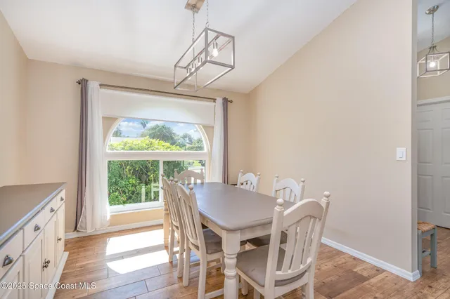 a view of a dining room with furniture window and outside view