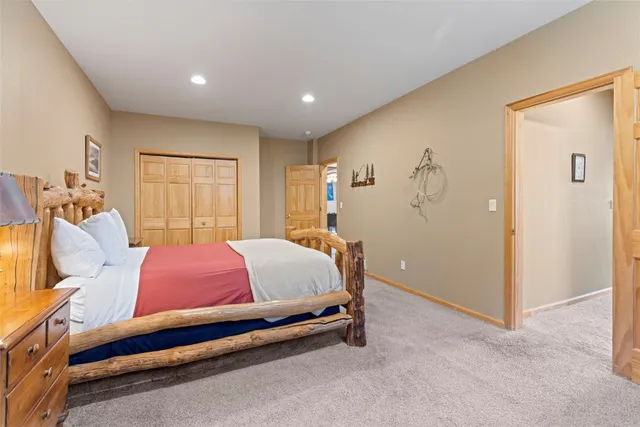 a bed room with a bed and a window