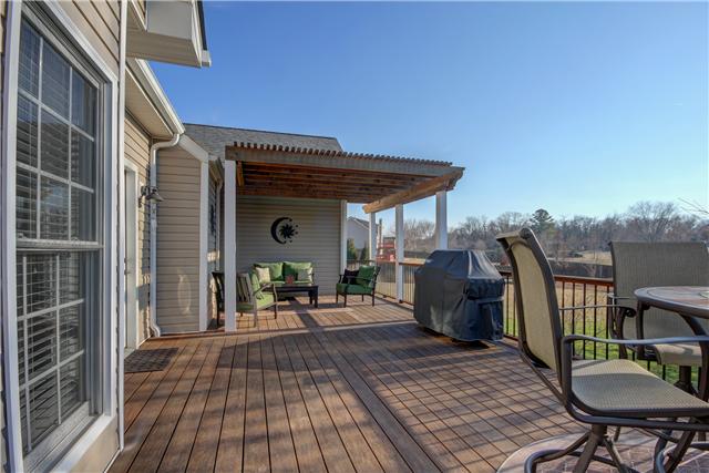3580 Rabbit Run Trail Adams, TN 37010 - Photo 18 of 20 Deck has door access from kitchen and living room. Extra large space for table setting and grill, pergola allows for a cozy seating nook.