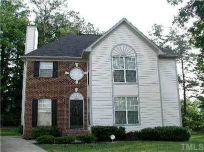 7408 Tennessee Court Raleigh, NC 27615 - Photo 1 of 1 a front view of a house with garden