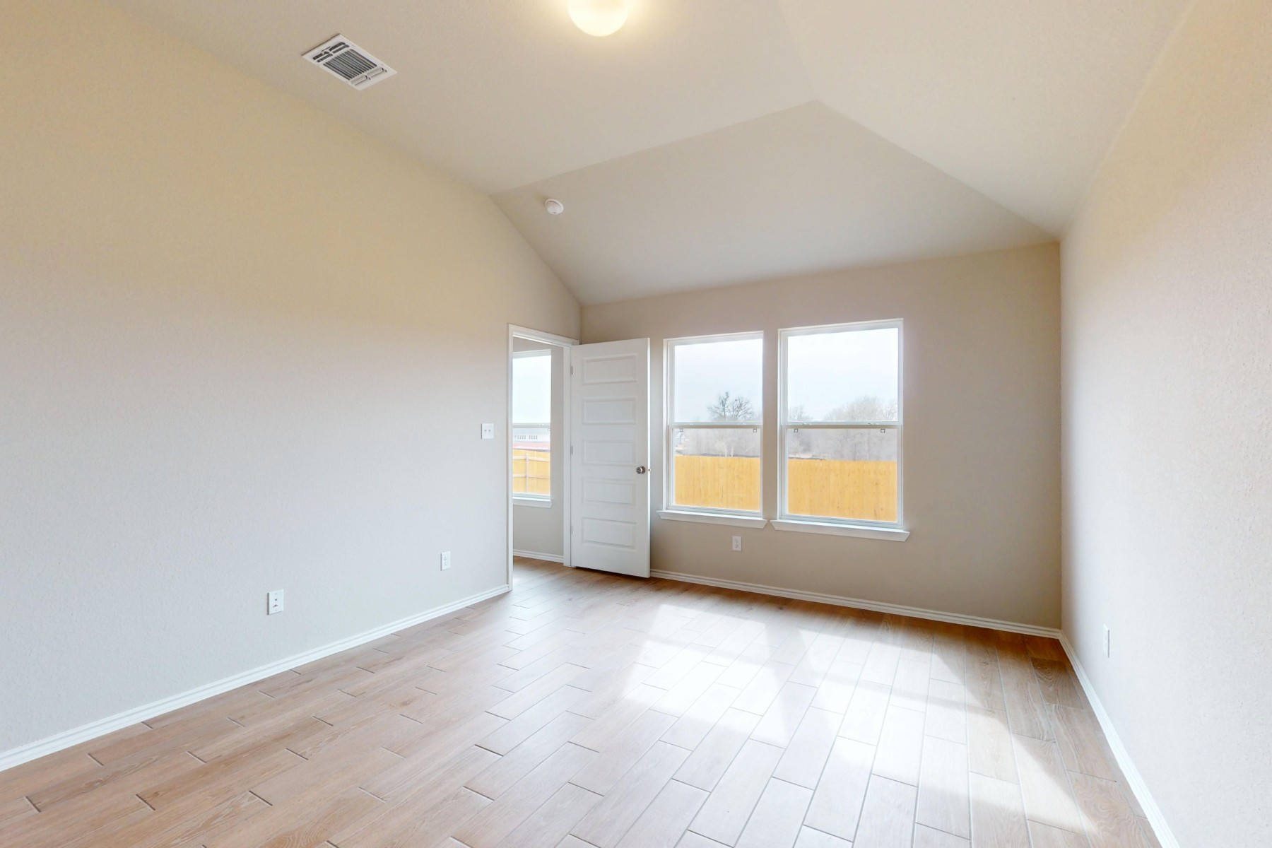20009 Hirono Drive Manor, TX 78653 - Photo 13 of 39 wooden floor in an empty room with a window