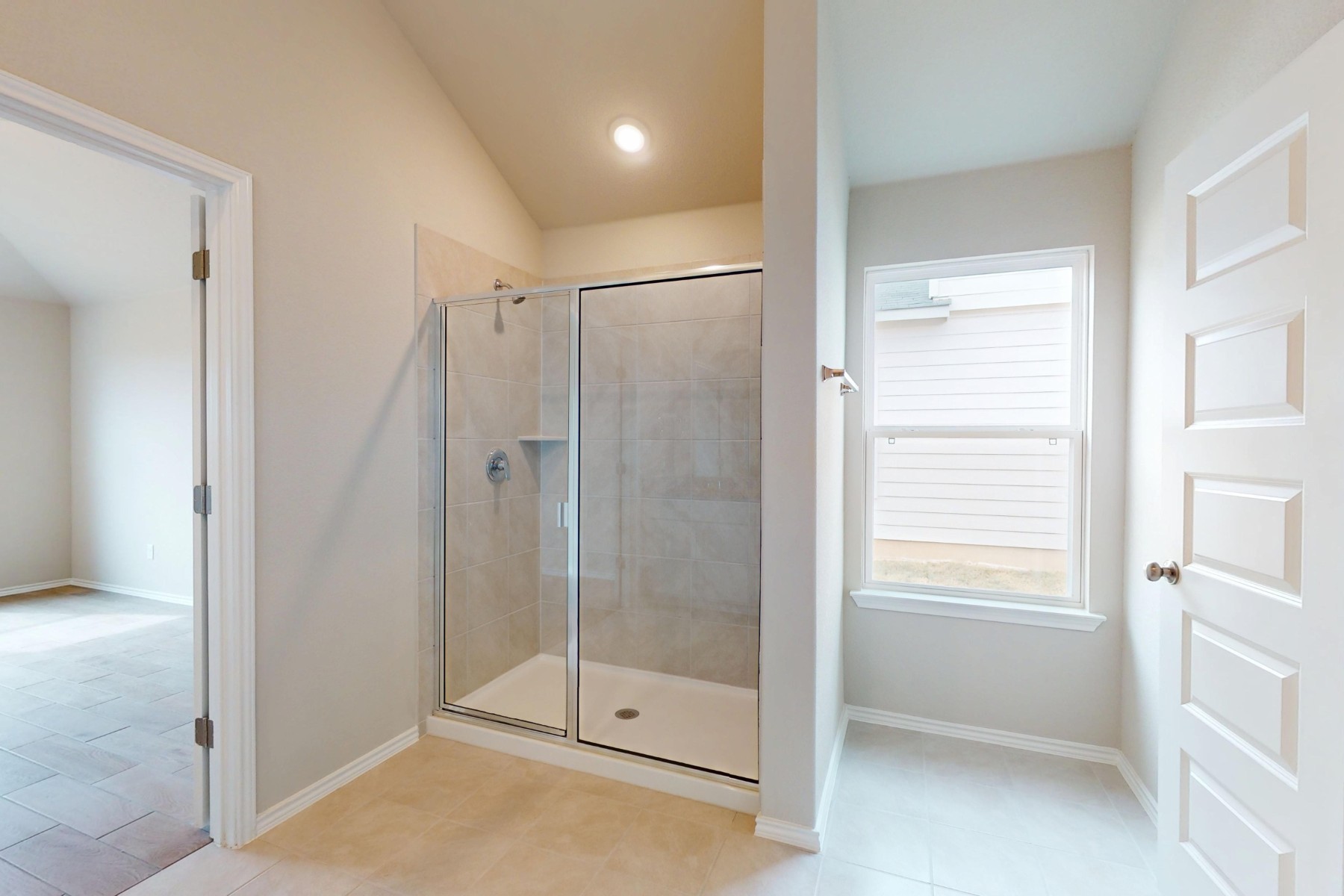 20009 Hirono Drive Manor, TX 78653 - Photo 16 of 39 a bathroom with a shower and a room