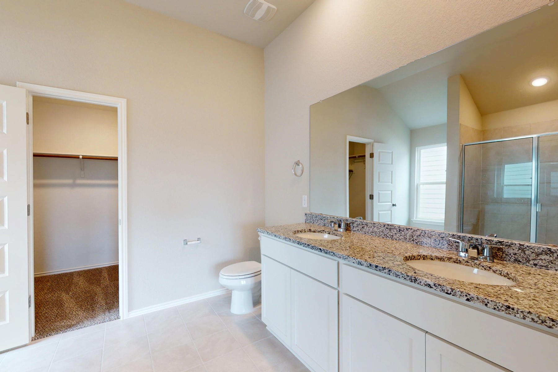 20009 Hirono Drive Manor, TX 78653 - Photo 17 of 39 a bathroom with a granite countertop sink and a mirror