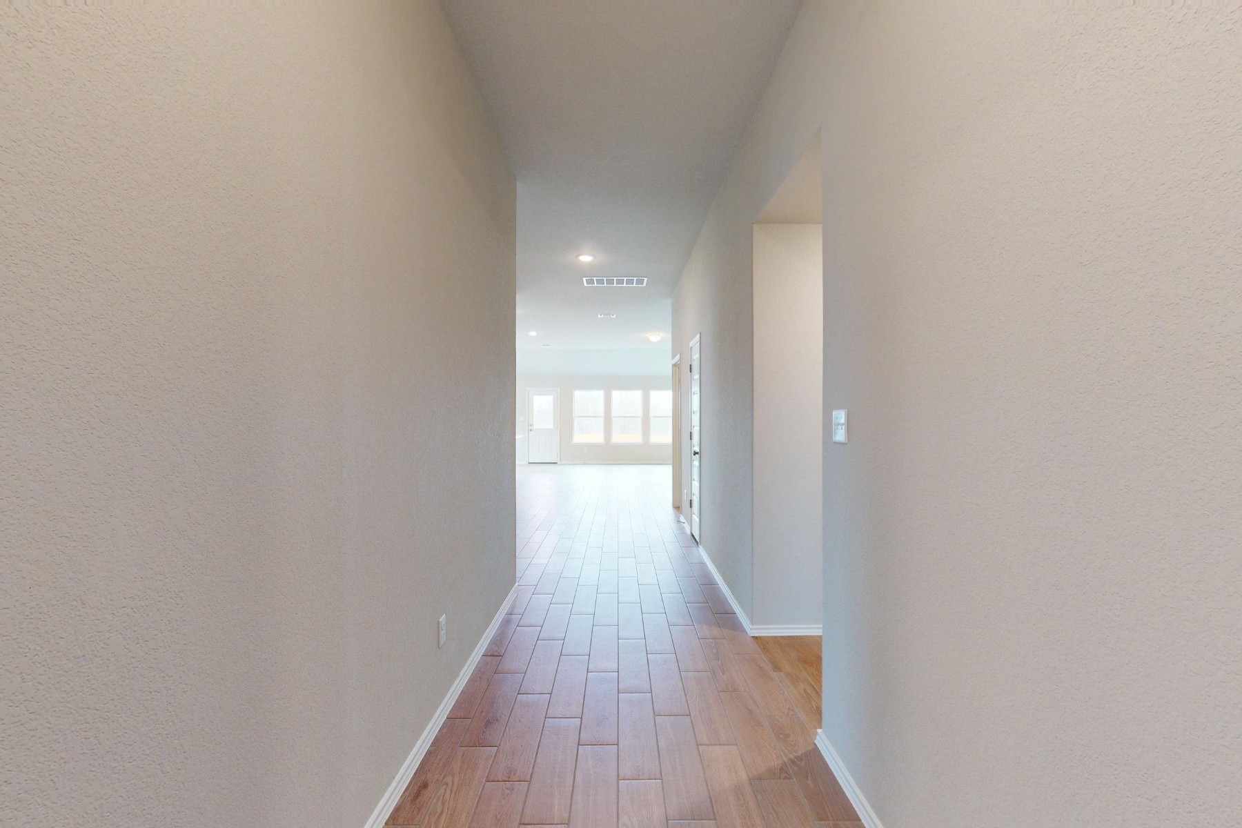 20009 Hirono Drive Manor, TX 78653 - Photo 21 of 39 a view of a hallway with wooden floor